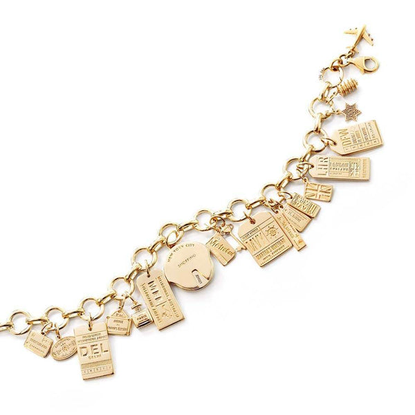 Tiffany 18K Yellow Gold Charm Bracelet, with 12- 10K and 14K Charms, L.- 7  1/2 in., Total Wt.- 1.45 Troy Oz. sold at auction on 19th March | Bidsquare